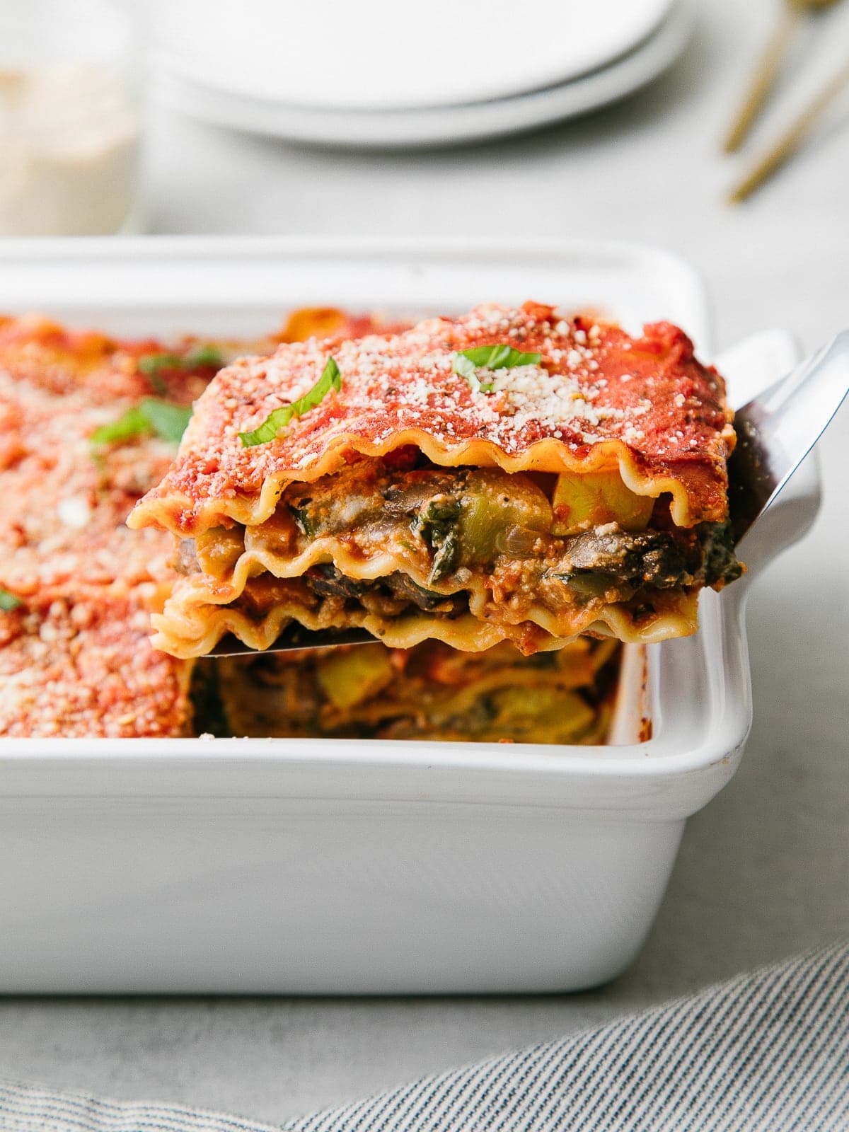 head on view of vegan lasagna on a spatula.
