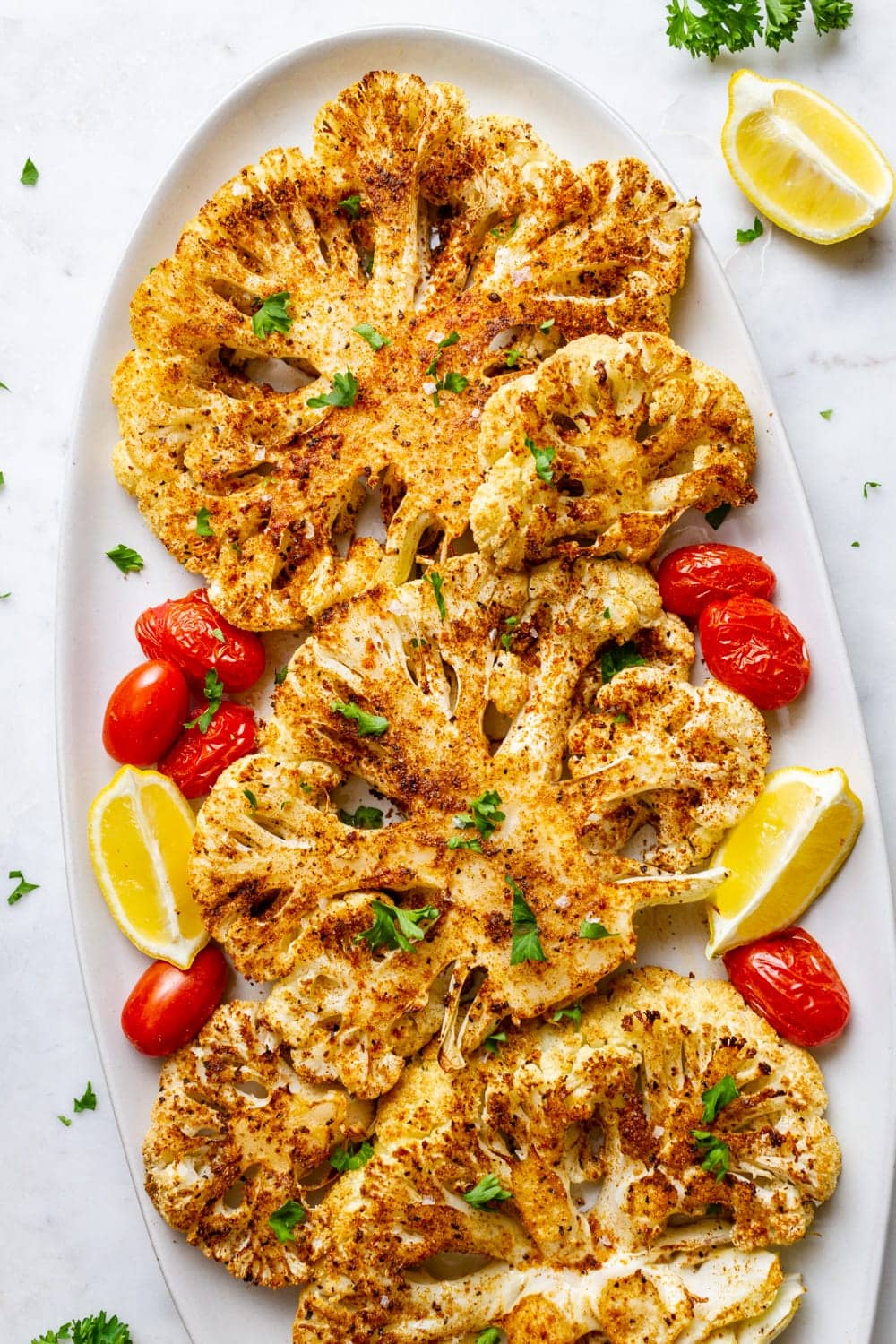 blackened cauliflower steaks on a platter