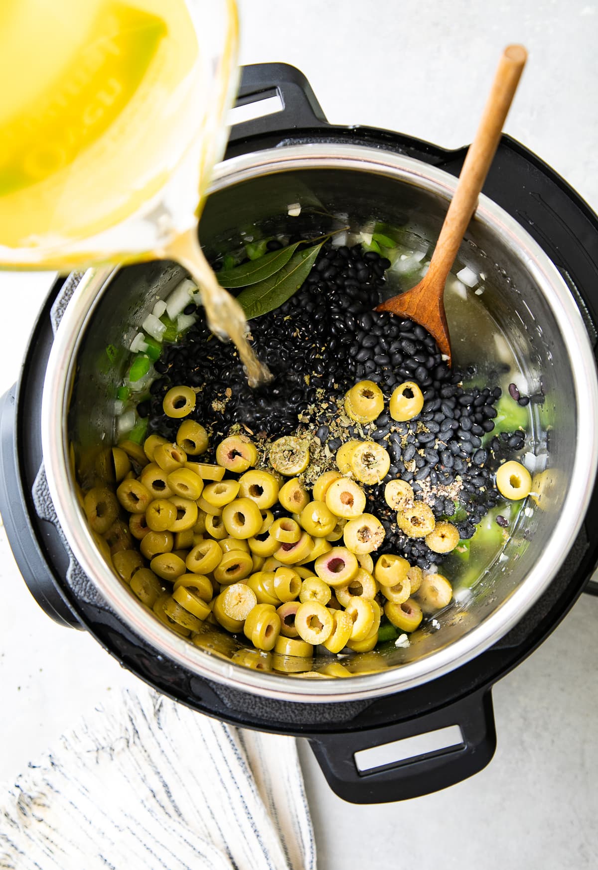 top down view of all ingredients added to instant pot to make cuban black beans recipe.