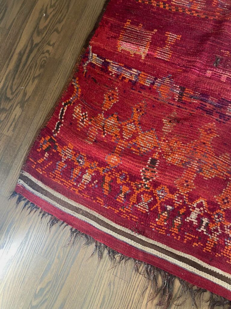 Detail of a red area rug