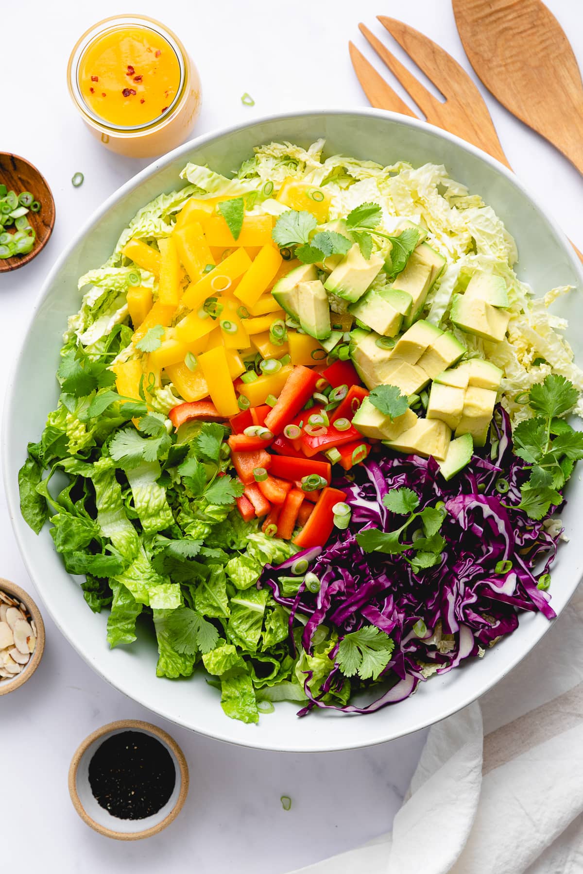 top down view of ingredients for chop chop salad added to bowl.