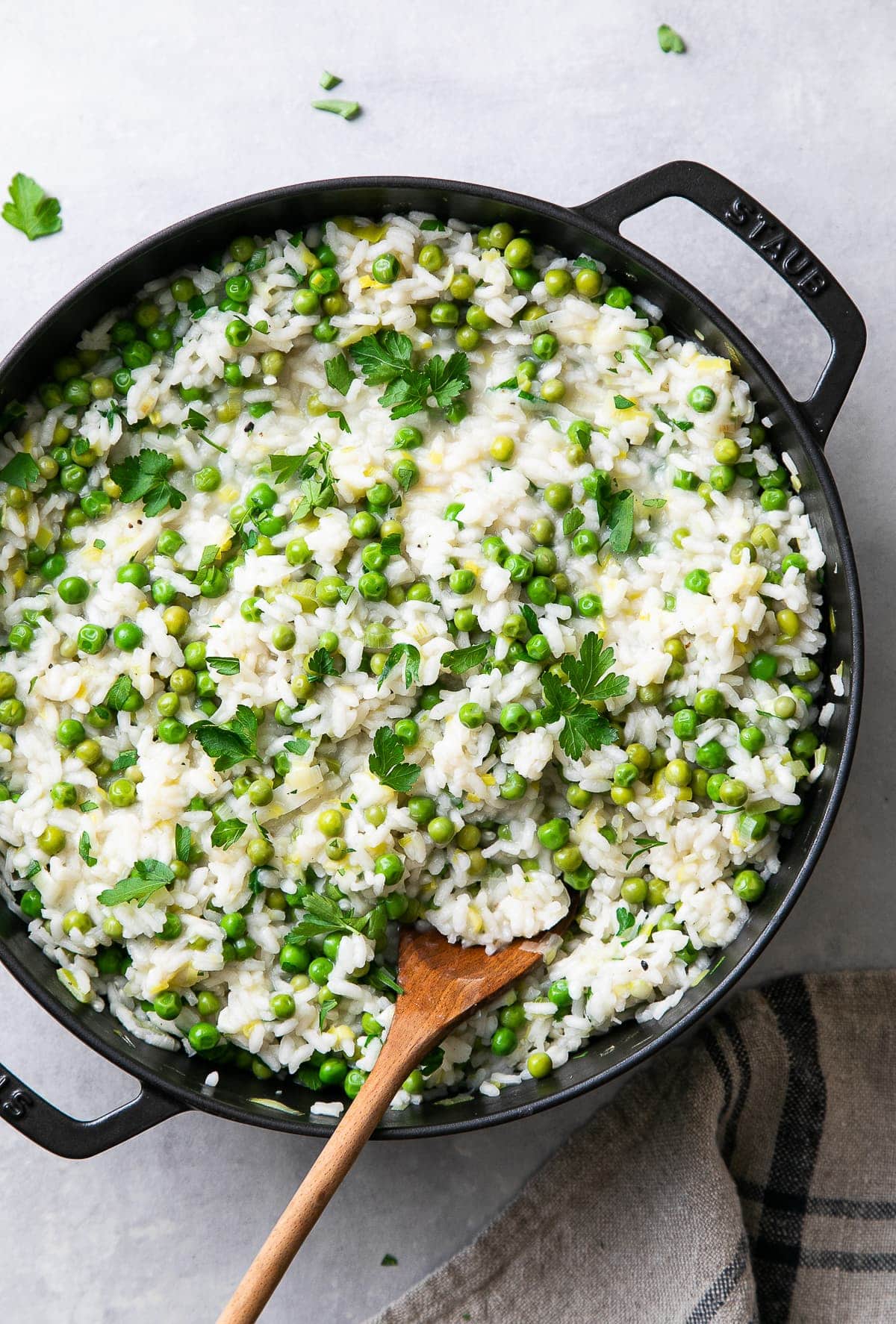 top down view of freshly made pot of creamy risi e bisi (rice and peas).