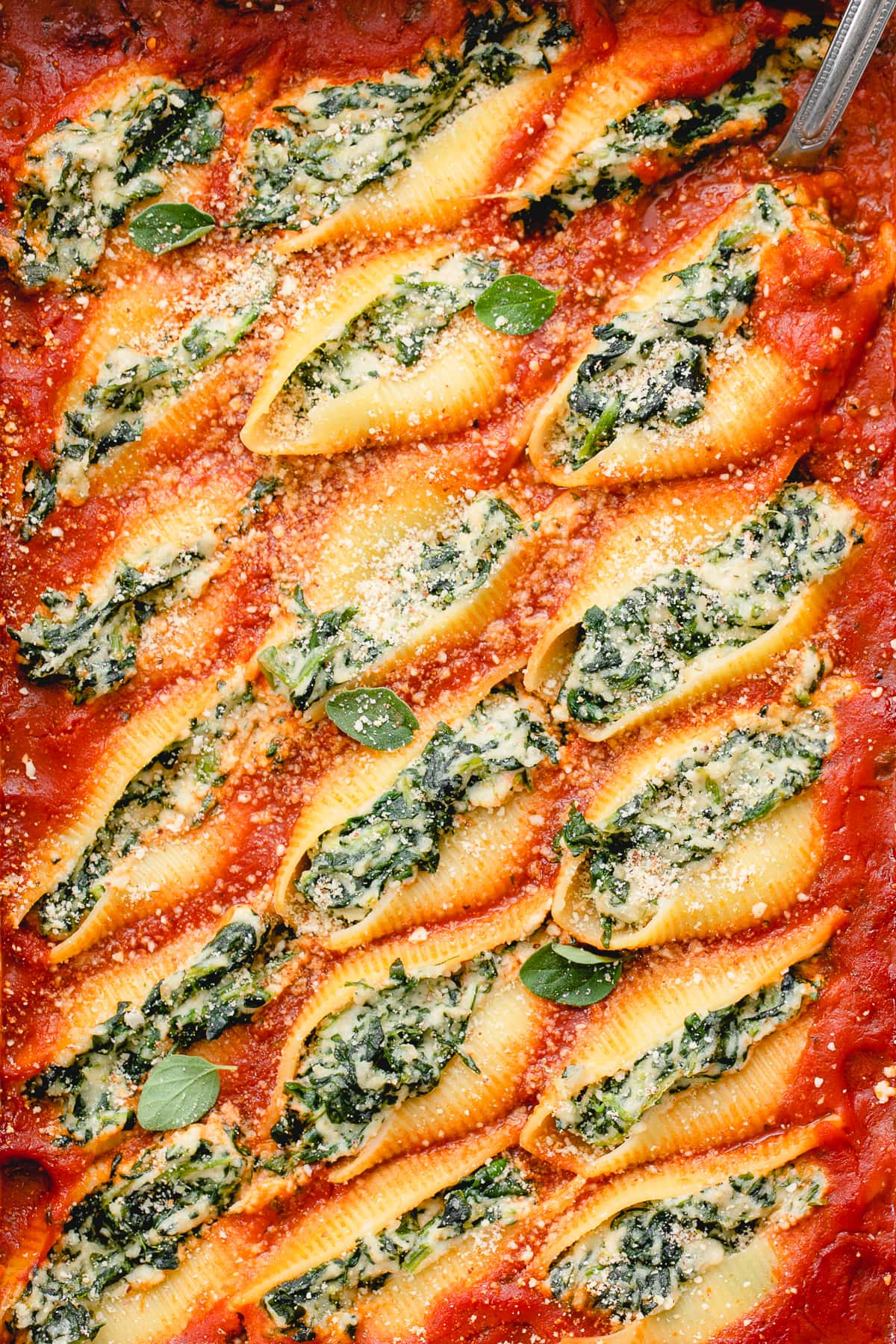 top down view of vegan stuffed shells in a baking dish.