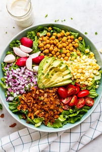 top down view of vegan california cobb salad before adding vegan ranch dressing.