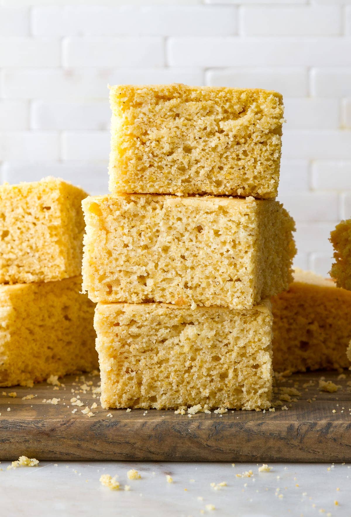 head on view of vegan cornbread stacked on each other.
