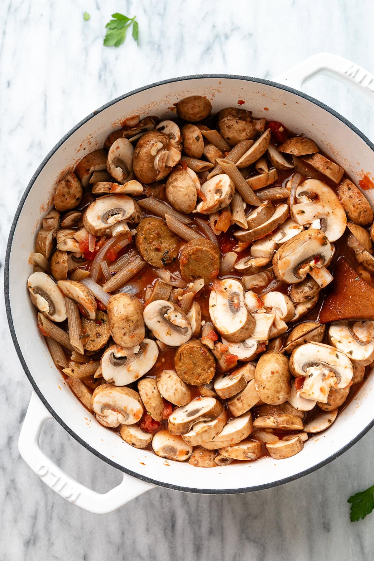 top down view of ingredients add to a white pot and ready to simmer.